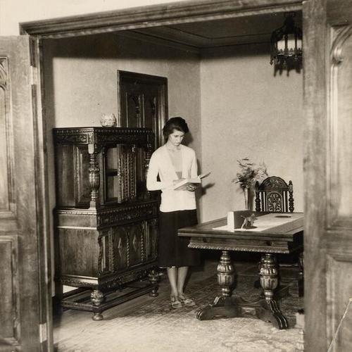 [Claire Weidenmuller reading a book at San Francisco College for Women]