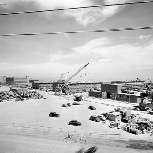 [View of new shops and cranes under construction at Naval Drydocks, Hunters Point]