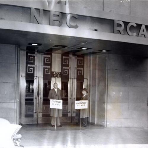 [Studio engineers Lee Kolm and Oscar Berg picketing in front of NBC building at 420 Taylor Street]