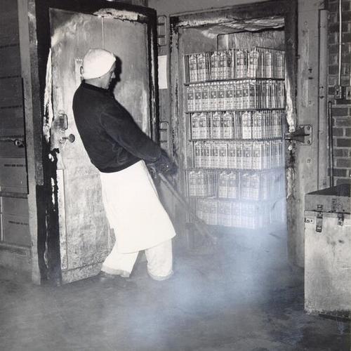 [M. H. Platek pulling a load of frozen milk out of a freezer at the Borden Company Plant at 1325 Potrero Avenue]