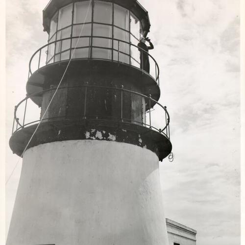 [Ira Cavender standing on the lookout atop the Farallon Islands lighthouse]