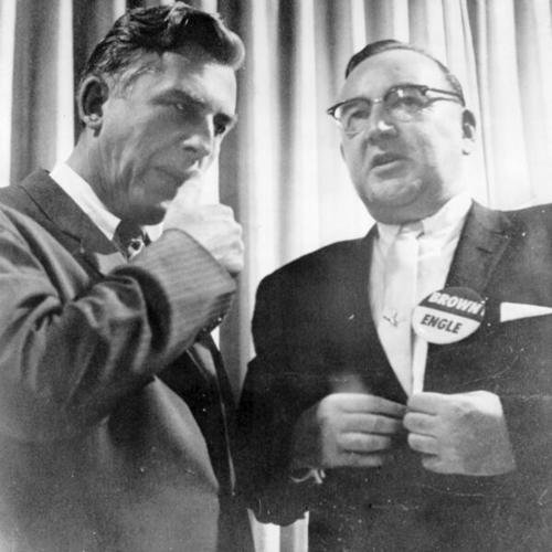 [Gov. Robert B. Meyner of New Jersey, left, talks with California's Attorney General Edmund G. Brown, candidate for governor, at a luncheon]