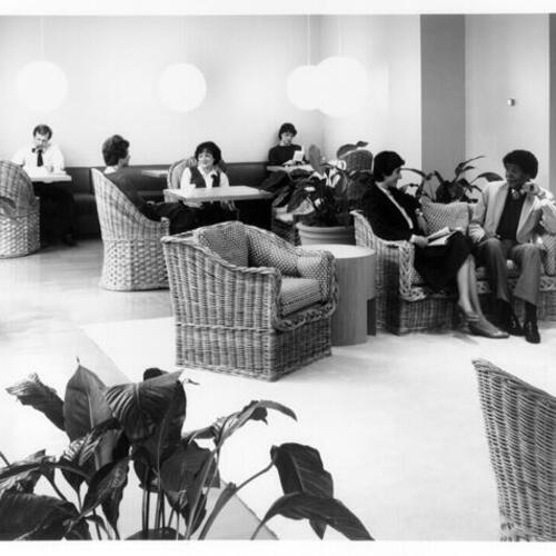 [Six people sitting in a lounge area in Levi Plaza]