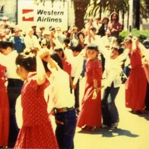 [Melissa, John's older sister, and other students dancing at Union Square in June as part of Filipino Independence Day celebration]