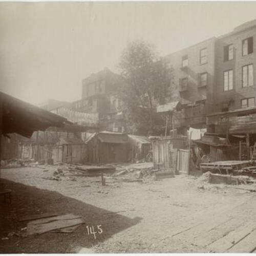 144 Demolition in progress of wooden buildings in Chinatown