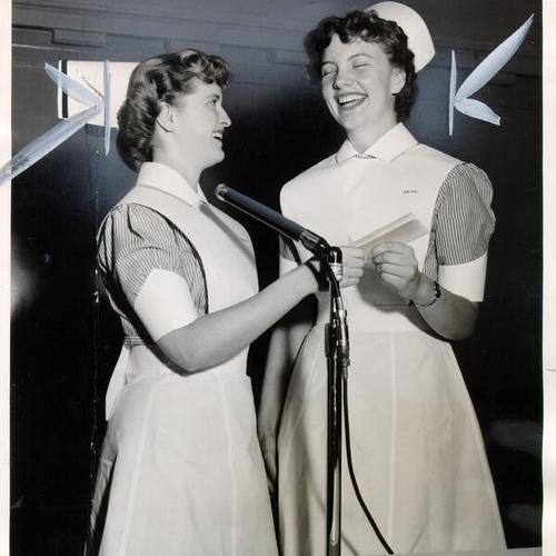 [Myra McCullough, president of the student body at St. Francis Memorial Hospital School of Nursing, awarding a scholarship to Shirley Ring]