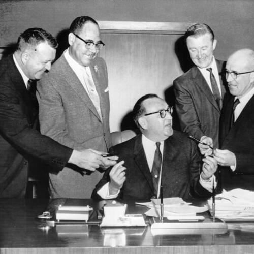[Governor Brown gives pens to sponsors of the state's first Fair Employment Practices Act]