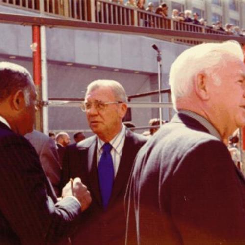 [William Chester, Sidney A. Haag, and CAO Tom Mellon at the Hallidie Plaza dedication]