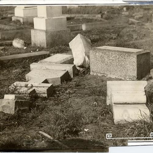 [Overturned gravestones at Laurel Hill Cemetery]