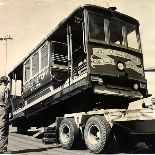[Motorized cable car loaded aboard a truck for delivery to the Mother Lode Round-up Parade]