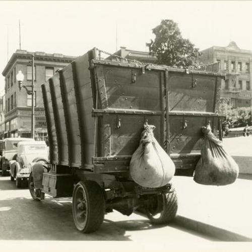 [Scavenger wagon truck in front of Portsmouth Plaza]