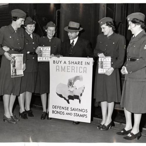 [T. Louis Chess district passenger agent of Southern Pacific with members of the American Women's Voluntary Services (AWVS)]