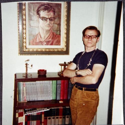 [A man standing next to his portrait at his apartment in 1968]