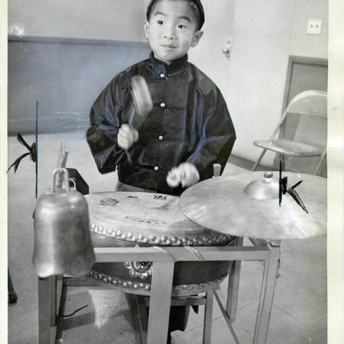 [David Young playing a drum at the Chinese Recreation Center at Mason and Washington streets in Chinatown]