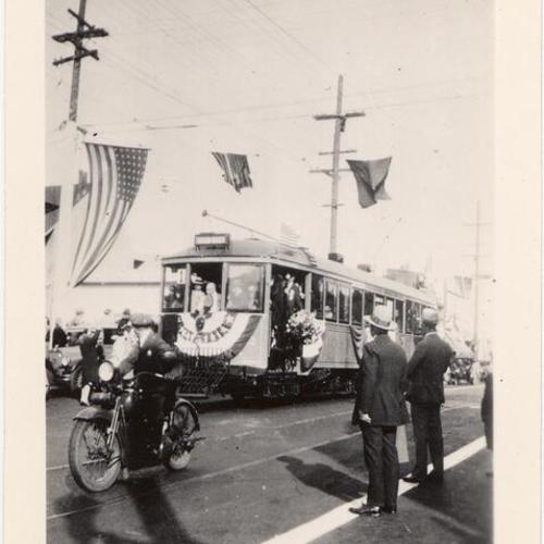 [Judah street and 10th avenue looking east showing Mayor Rolph at controls of first "N" car #102]