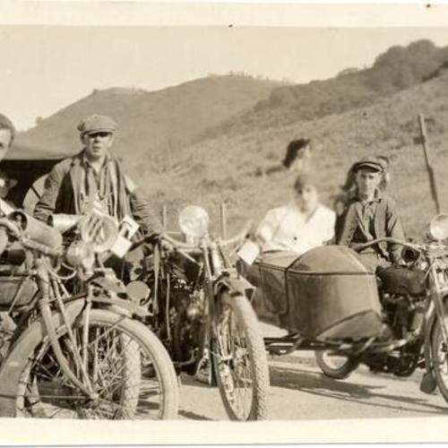 [Some members of the San Francisco Motorcycle Club (SFMC) posing with their motorcycles]