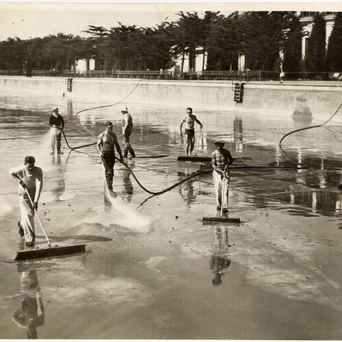 [Fleishhacker Pool, maintenance workers cleaning, July 12, 1933]