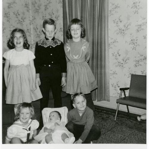 [Children at a baby christening in 1965]