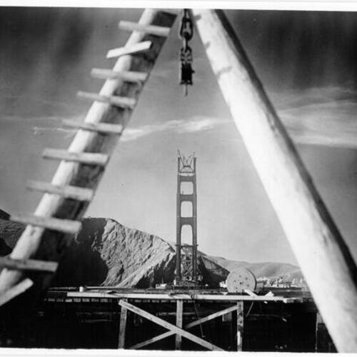[Marin tower of Golden Gate Bridge under construction seen from San Francisco]