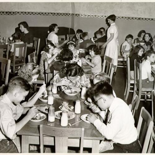[Children eating in the dining room at Sunshine Orthopedic School]