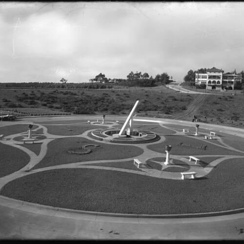 Ingleside Terraces sundial at Entrada Court with clubhouse in background