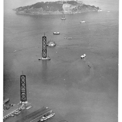 [Aerial view of the San Francisco-Oakland Bay Bridge under construction]