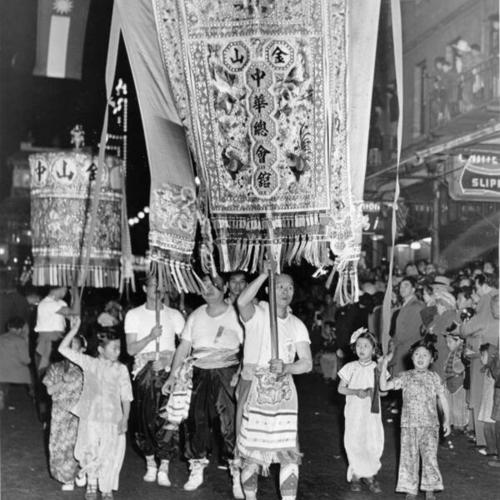 [Leading banner in Chinatown's Portola Parade]