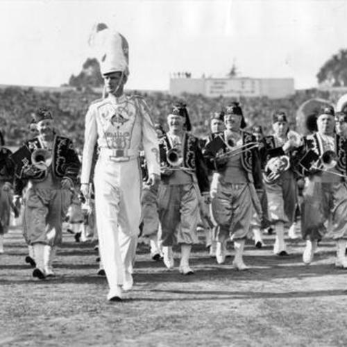 [Marching band on the field at Kezar Stadium before a football game]