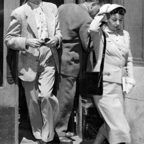 [Harry Bridges leaving I.L.W.U. headquarters with his wife Nancy]