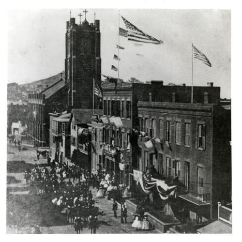 [Fourth of July parade passing in front of Old St. Mary's Church on Dupont Street]