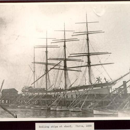 Sailing ships at wharf. Circa, 1885