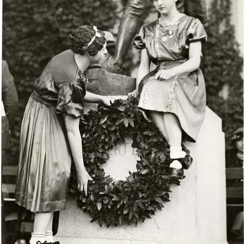 [Marie and Josephine Sheehan placing a wreath on the statue of Robert Emmet in Golden Gate Park]