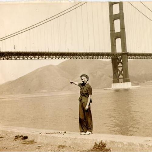 [Mrs. Charlie Delps pointing to the spot where her husband dived off the Golden Gate Bridge into the bay]