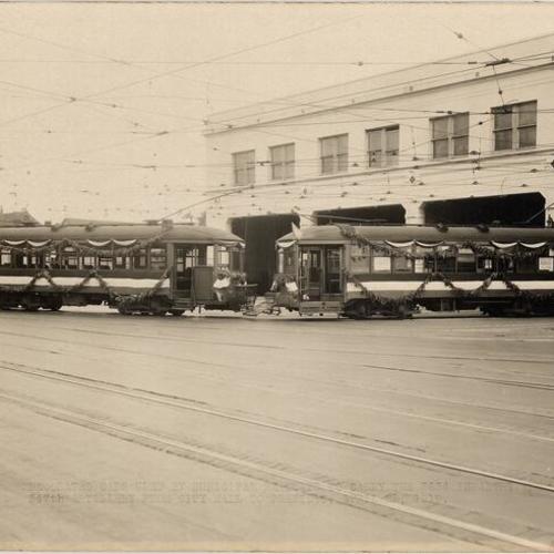 [Decorated cars used by Municipal Railway to carry the 363d Infantry and 347th Artillery from City Hall to Presidio,