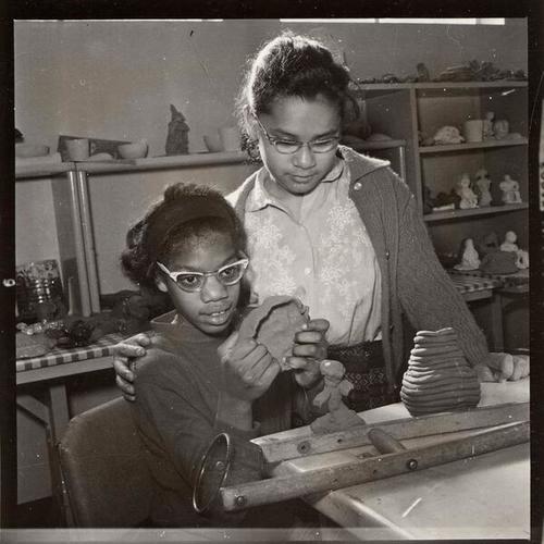 [Young girl working with clay at the San Francisco Recreation Center for the Handicapped]