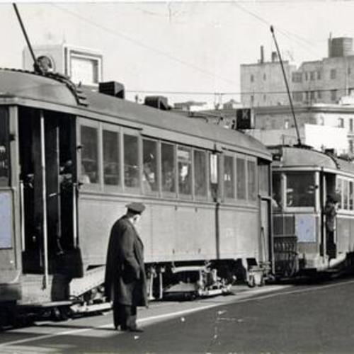 [Three streetcars lined up in a row at Market and Valencia Street]