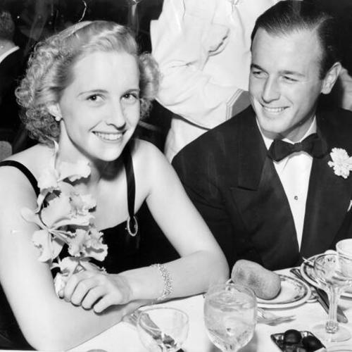 [Miss Nancy Heywood and Thornton Howell sitting together at the Palace Hotel]