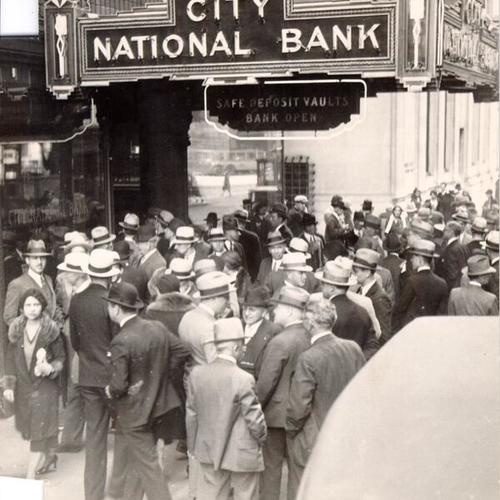 [Crowd of people in front of City National Bank]