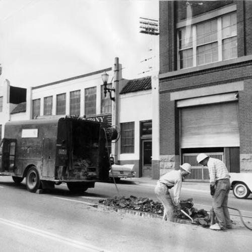 [P.G. & E. crew repairing street on 100 block of Potrero Avenue]