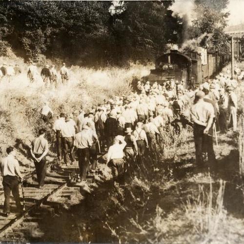 [Strikers blocking a Belt Line Railroad train bound for the waterfront during the longshoremen's strike of 1934]