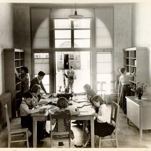[Students in the library at Sunshine Orthopedic School]