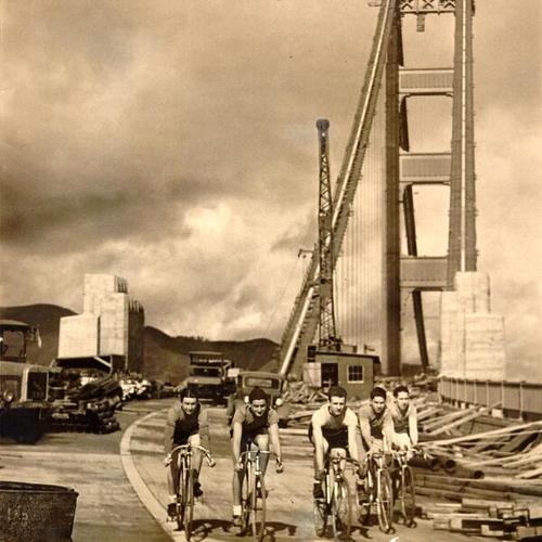  group of cyclists bicycling on Golden Gate Bridge]