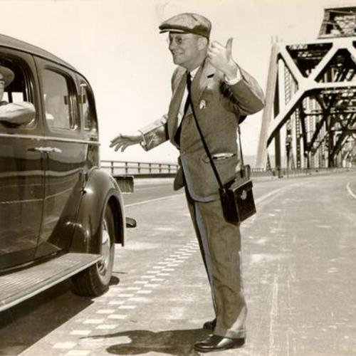 [Colonel Willard Chevalier hitchhiking on the San Francisco-Oakland Bay Bridge]