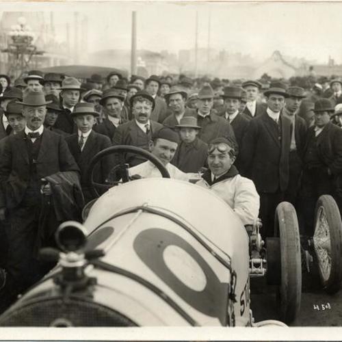 [Earl Cooper posing in a race car at the Panama-Pacific International Exposition]