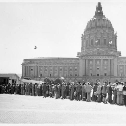 [Chinese technicians registering for housing at one of three dormitories in the Civic Center, across from City Hall]