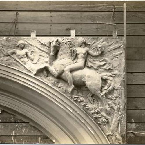 [Construction of War Memorial Opera House, showing decorative sculpture above archway]