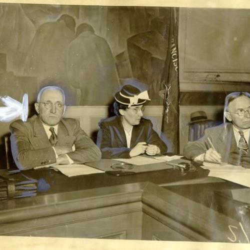 [William A. Weiland, Edith Pence and William J. Drew at a meeting of school principals]