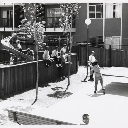 [Children playing at the St. Francis Square Housing Development Play Center]