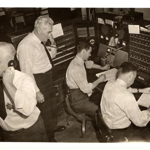[Officers working at the communication room in Old Hall of Justice]