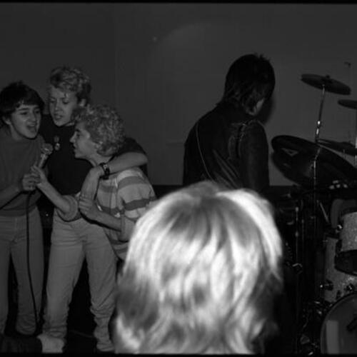V. Vale's band performing at Aitos, Berkeley; with Karla 'Maddog' Duplantier and audience participation from girl gang the Pop Tarts, (right to left) Suzie, Caitlin, and Gordon